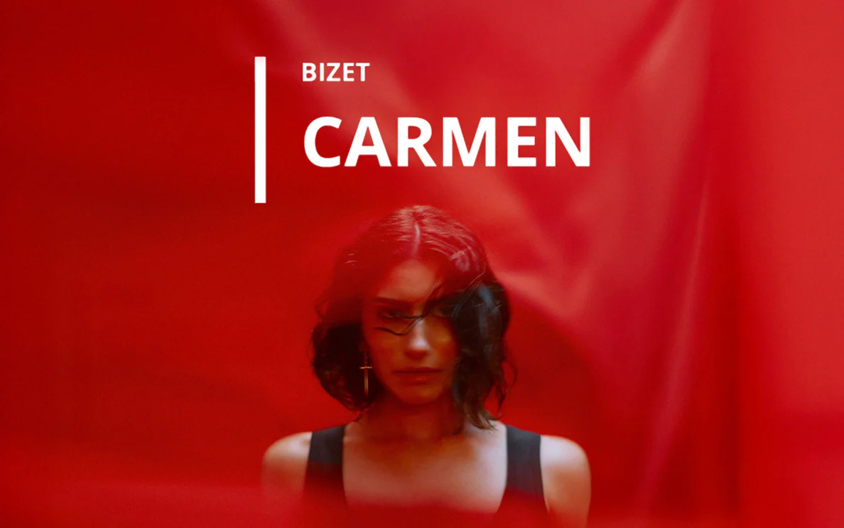 Bizet's Carmen opera poster with a woman against a red background.