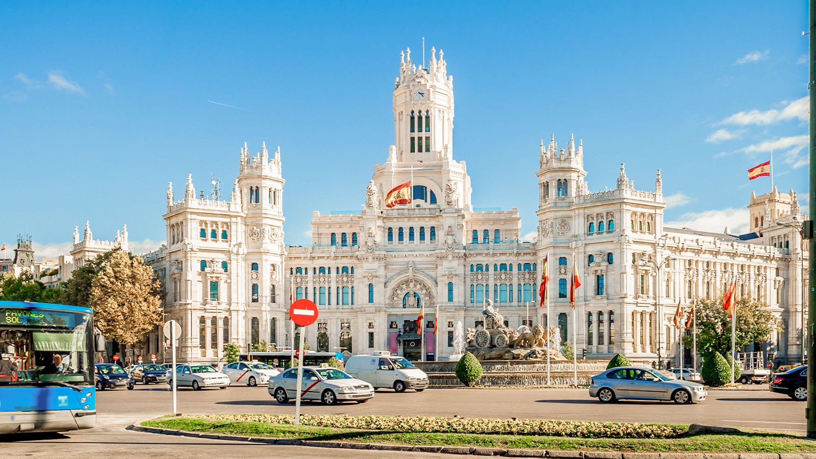 Plaza de Cibeles with Madrid Hop-On Hop-Off bus in foreground.