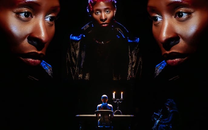 Performer on stage with dramatic lighting in Dracula Westend show.