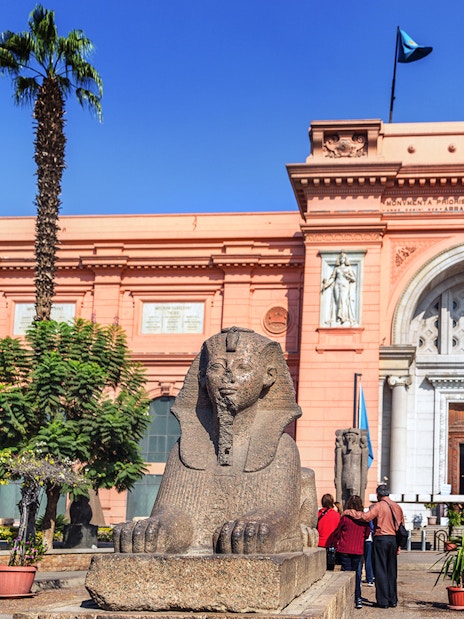 Sphinx statue in front of the Egyptian Museum entrance in Cairo, Egypt.