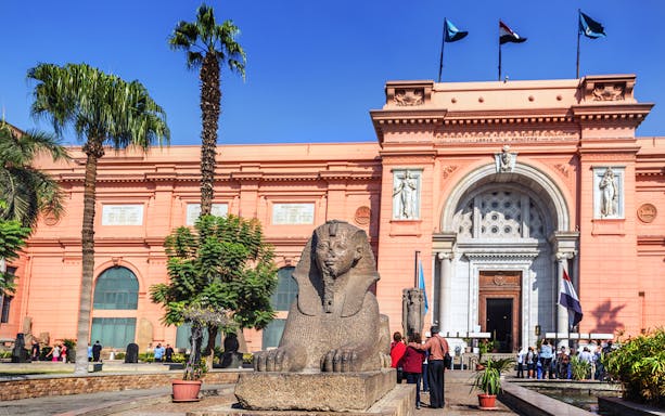 Sphinx statue in front of the Egyptian Museum entrance in Cairo, Egypt.
