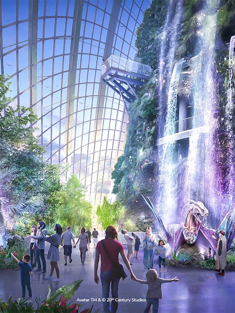 Visitors exploring the Avatar-themed Cloud Forest with waterfalls and lush greenery in Singapore.