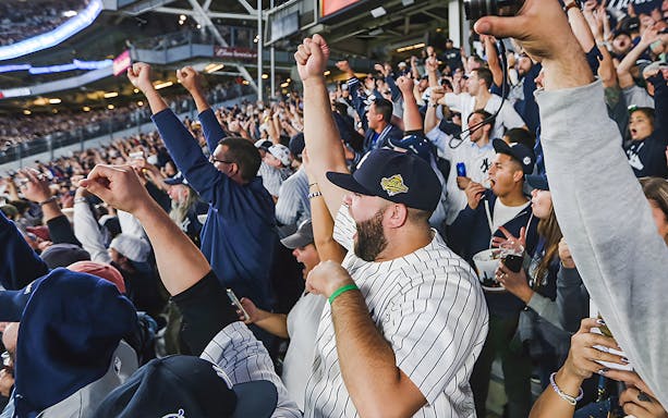 Fans cheering at a New York Yankees vs Washington Nationals game, August 24, 2023.