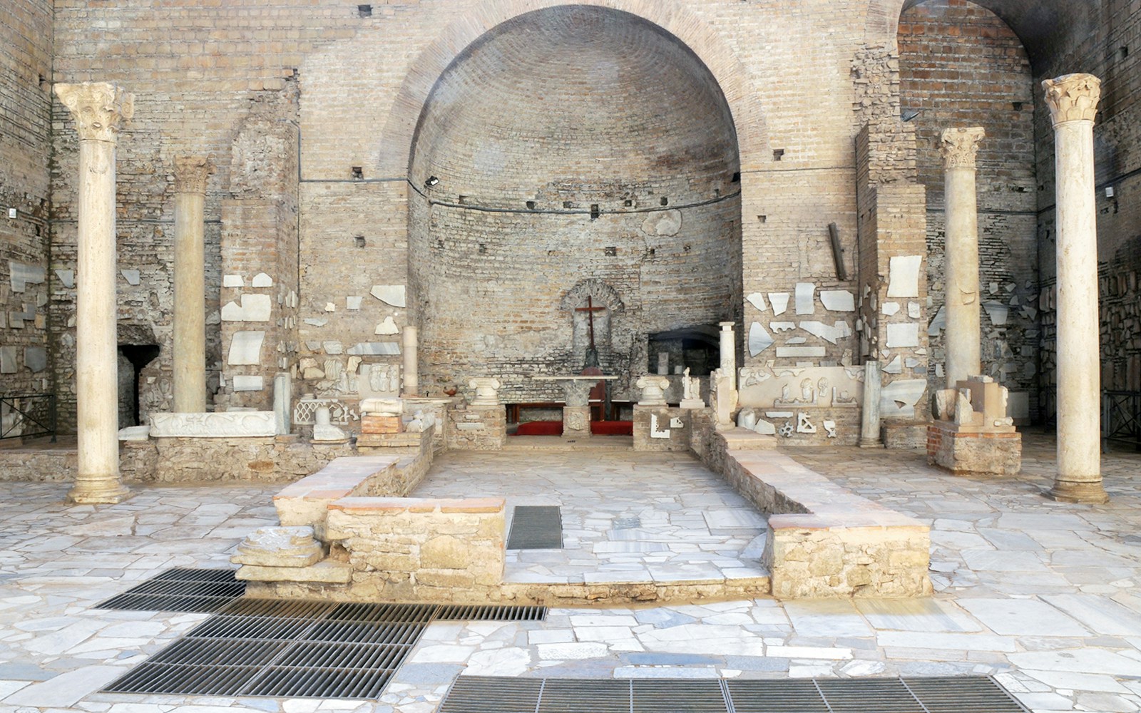 Catacombs of Domitilla interior with ancient columns and altar, Rome guided tour.