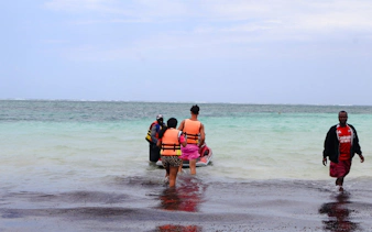 People preparing for a jet-ski ride at Diani Beach, Kenya.