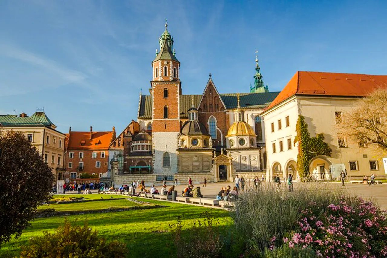 Wawel Castle courtyard with tourists in Krakow's Old Town.