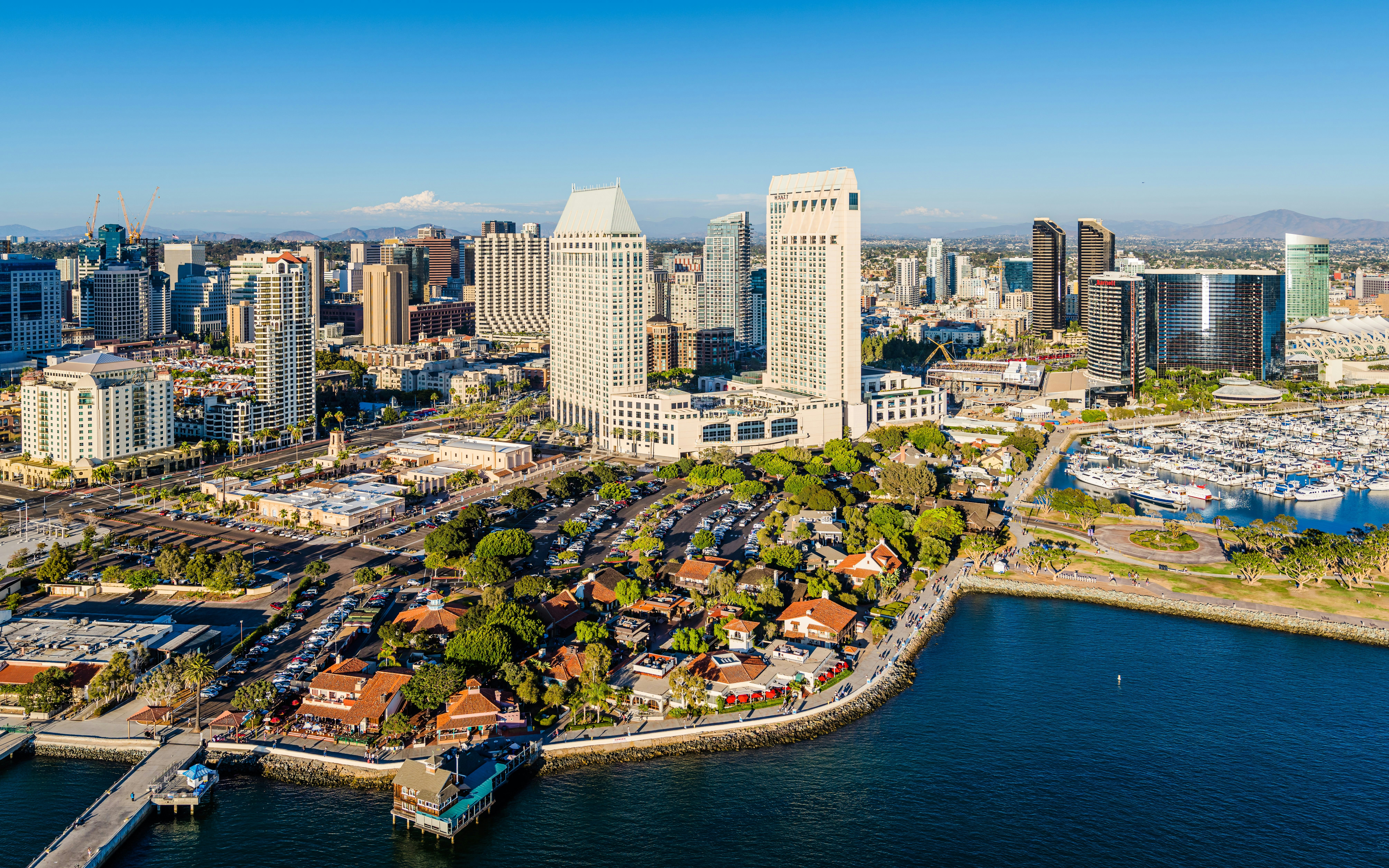 Aerial view of Seaport Village in San Diego with waterfront and city skyline.