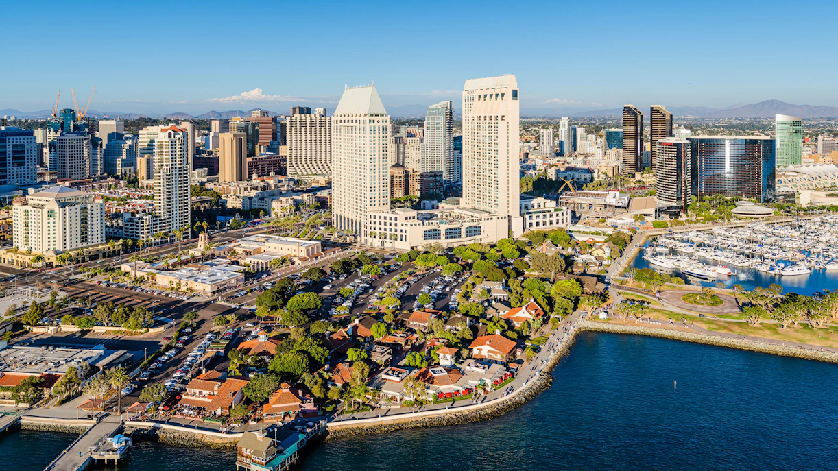 Aerial view of Seaport Village in San Diego with waterfront and city skyline.