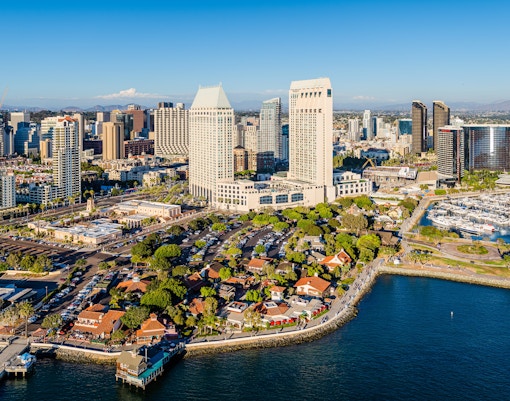 Aerial view of Seaport Village in San Diego with waterfront and city skyline.