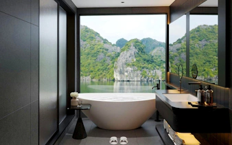 Junior Ocean Suite bathroom with Ha Long Bay view on 6-star luxury cruise.