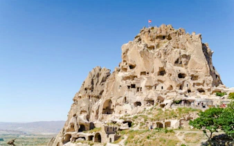 Uchisar Castle rock formation with cave dwellings, Cappadocia.