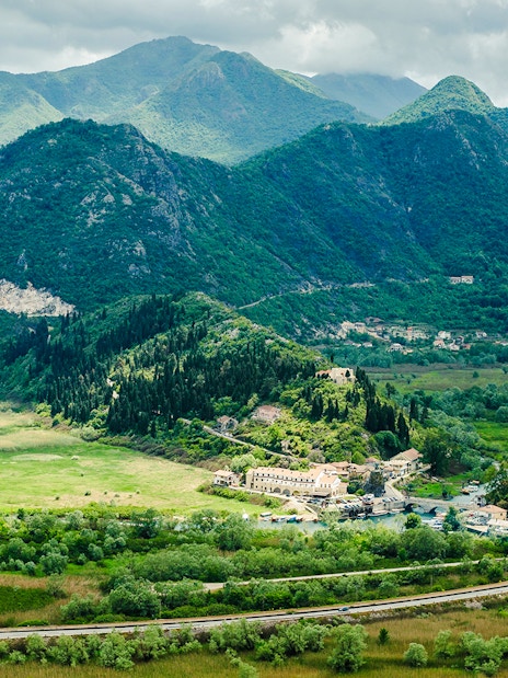 Virpazar village surrounded by lush mountains at Lake Skadar National Park.