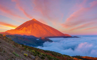 Teide National Park at sunset with clouds and volcanic landscape, Tenerife.