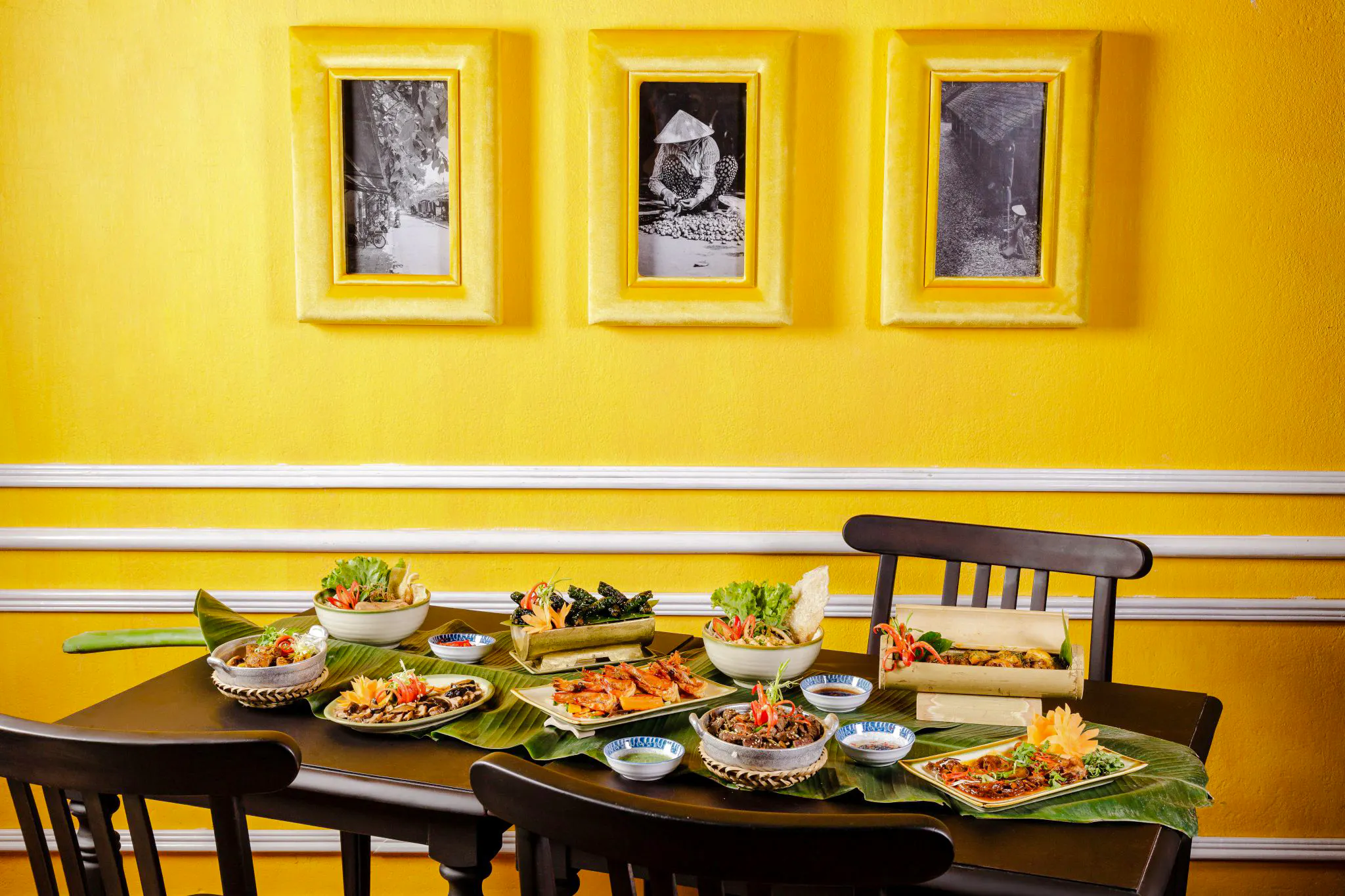 All-you-can-eat Vietnamese dishes on a table at HOME Hoi An Restaurant, Hoi An.