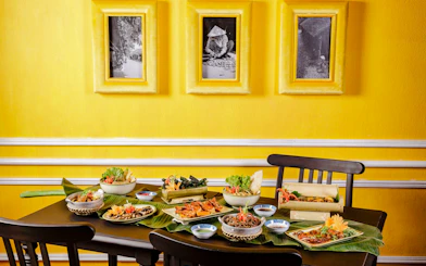 All-you-can-eat Vietnamese dishes on a table at HOME Hoi An Restaurant, Hoi An.