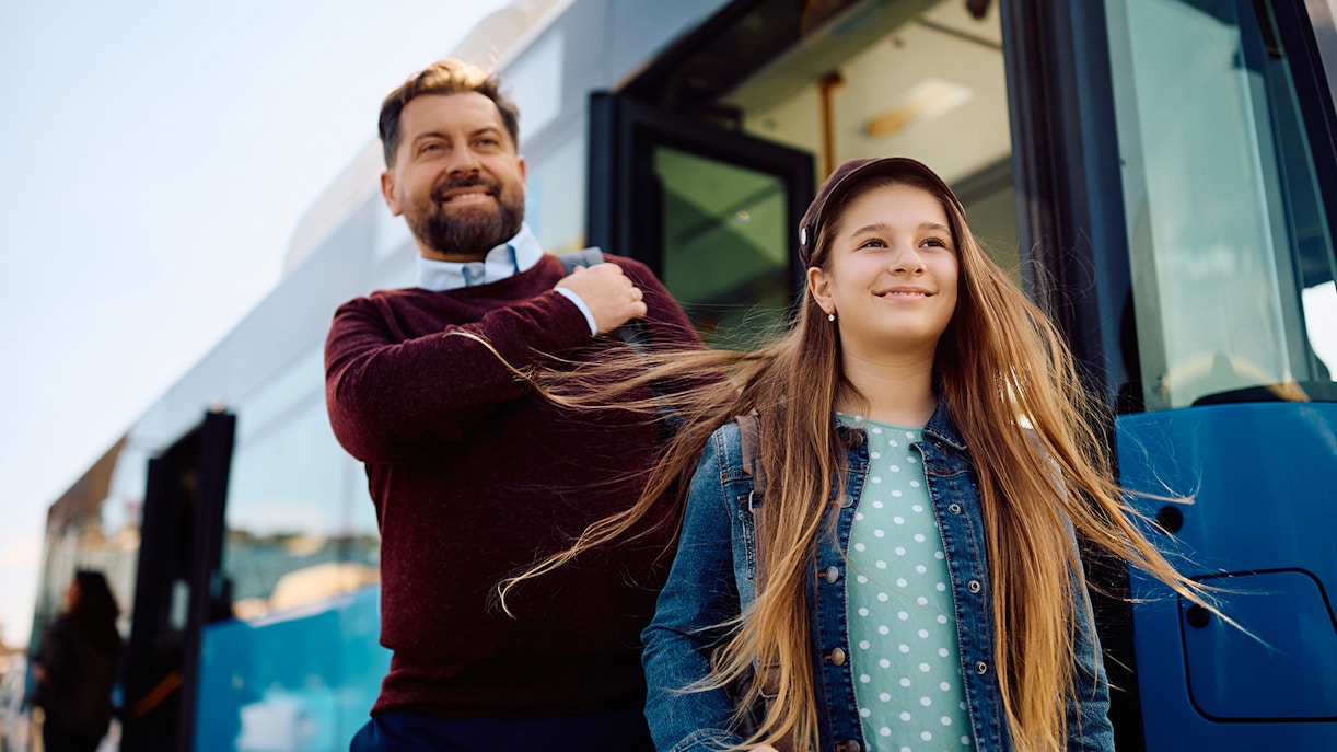 Tourists disembarking from a bus