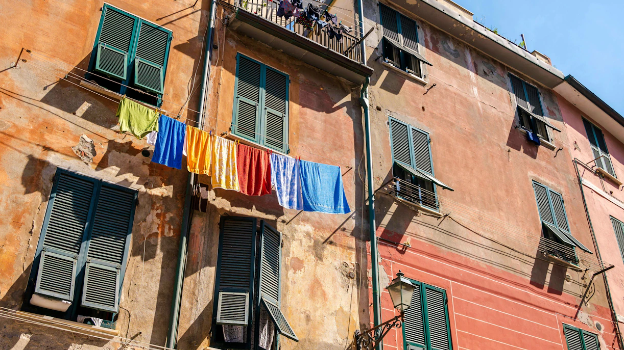 Towels hanging on clotheslines along Via Roma in Vernazza, Italy.