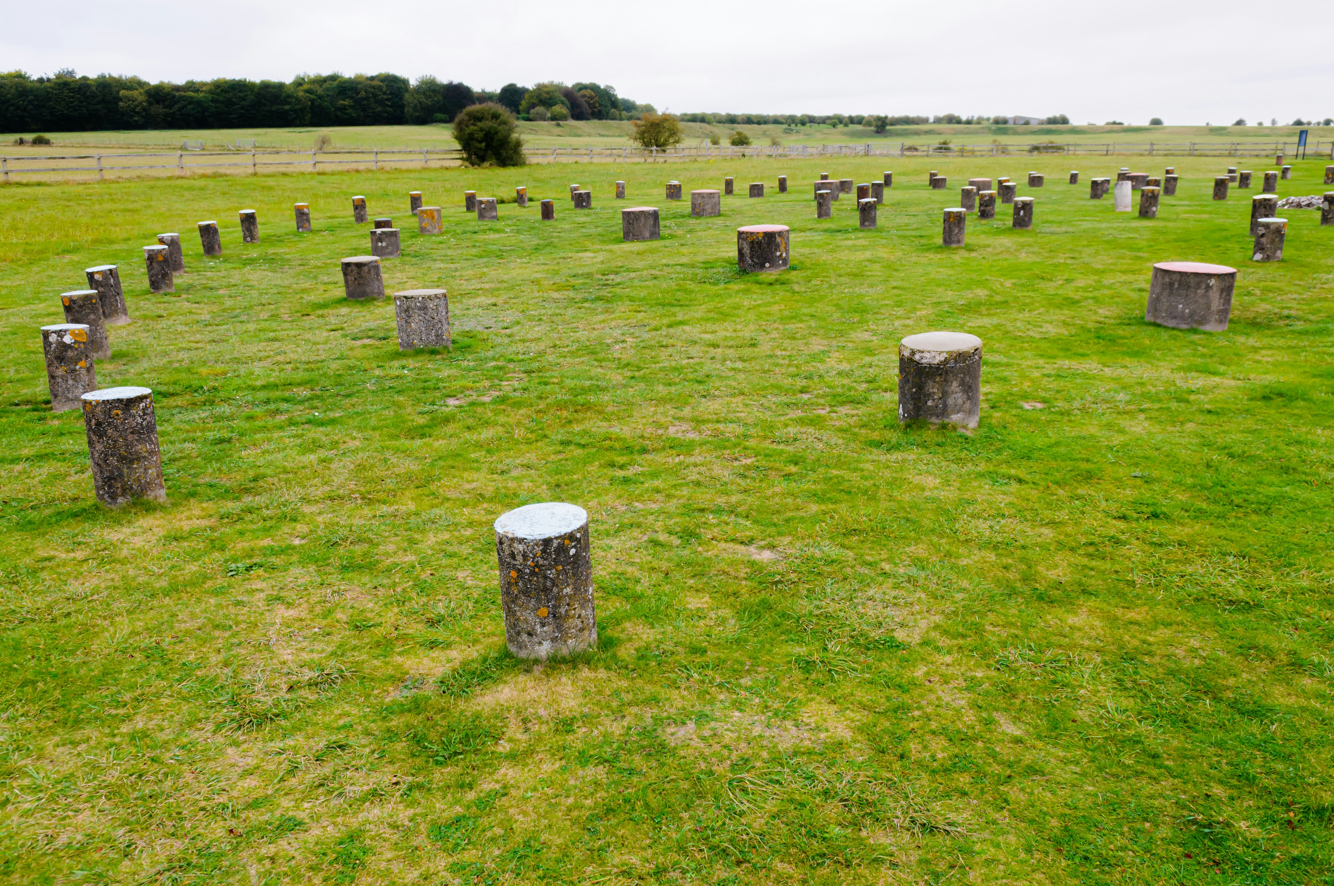 Stone circle at Woodhenge, Wiltshire, surrounded by green fields.