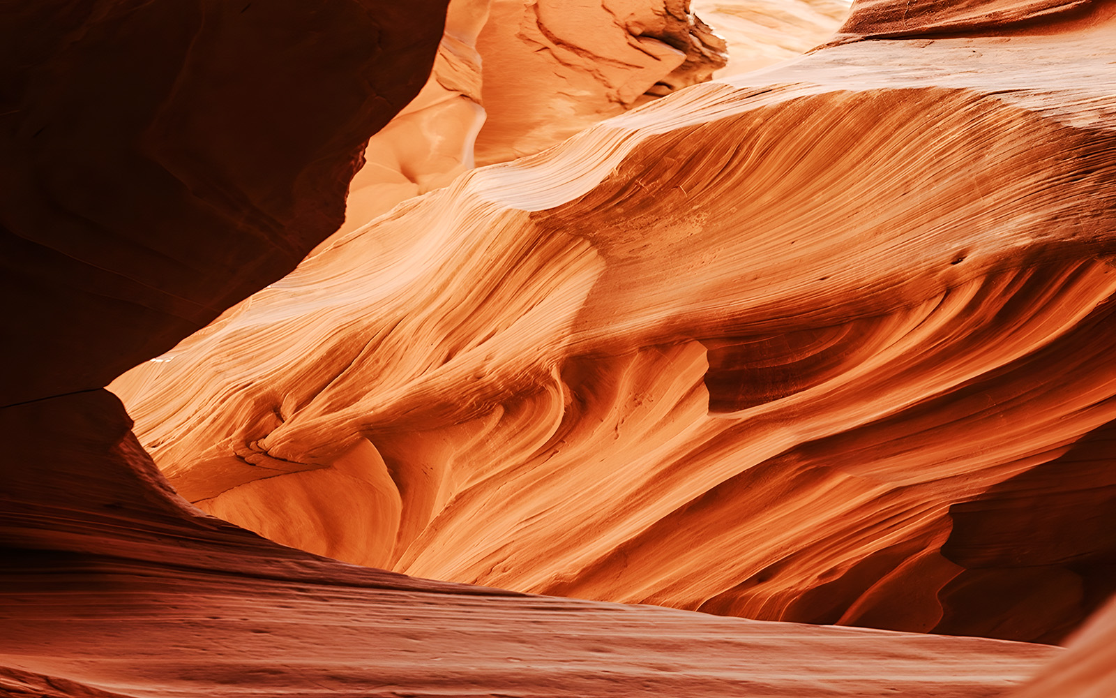 Curved sandstone formations in Waterhole Canyon, Arizona.