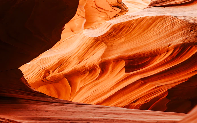 Curved sandstone formations in Waterhole Canyon, Arizona.