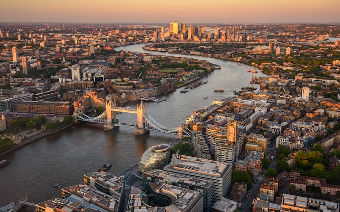 London skyline with Tower Bridge and Thames River at sunset from The Shard.