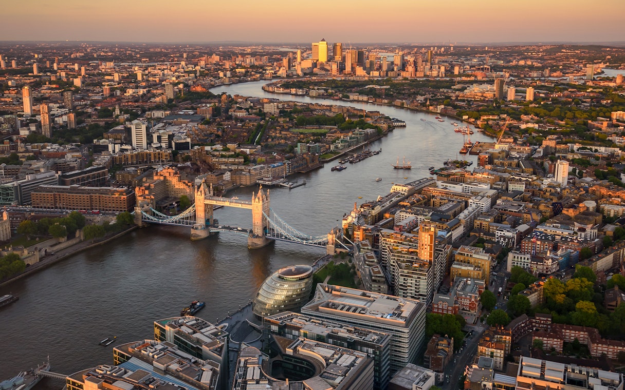 London skyline with Tower Bridge and Thames River at sunset from The Shard.