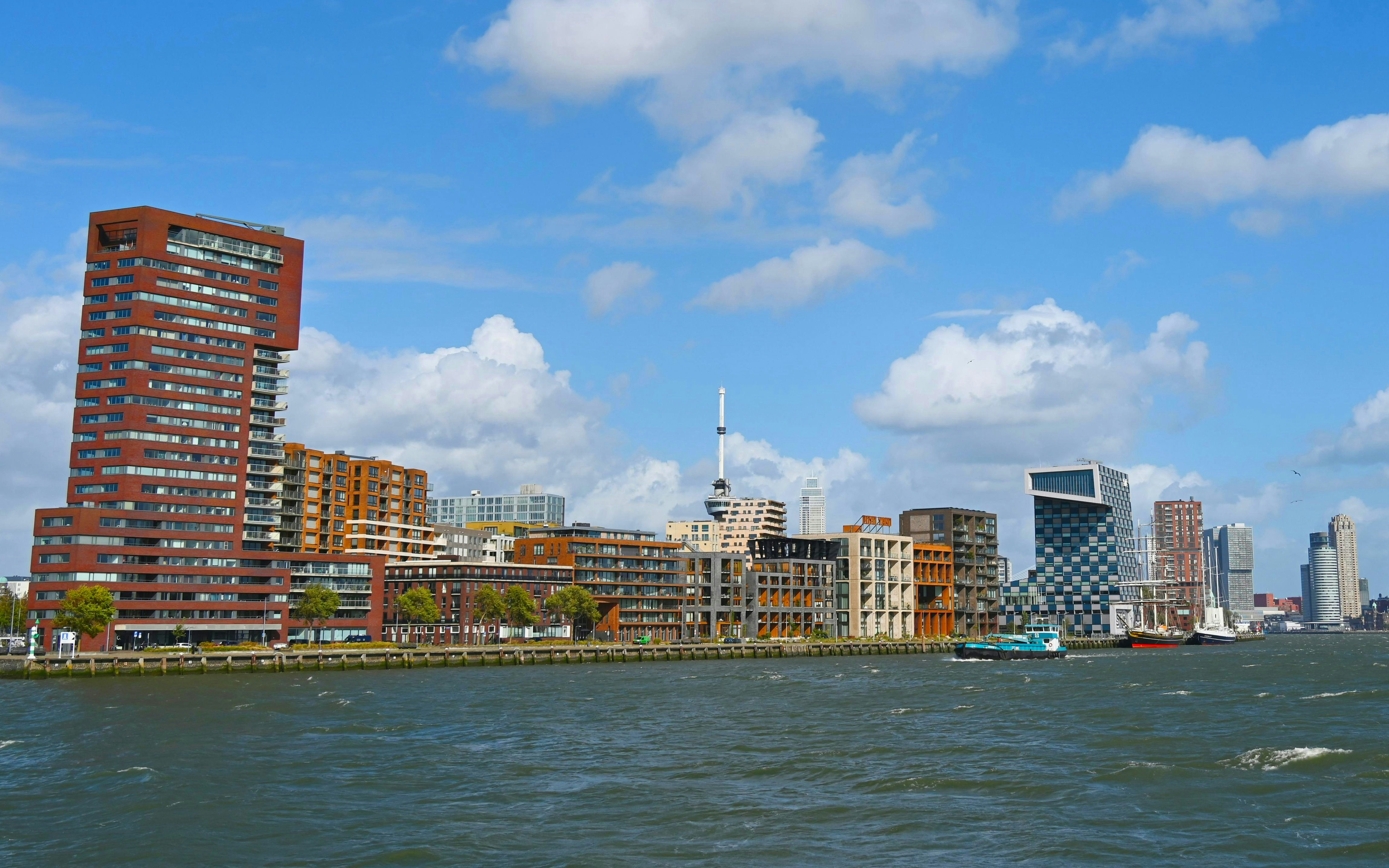 Skyline of Rotterdam's Lloydkwartier district with modern buildings along the harbor.
