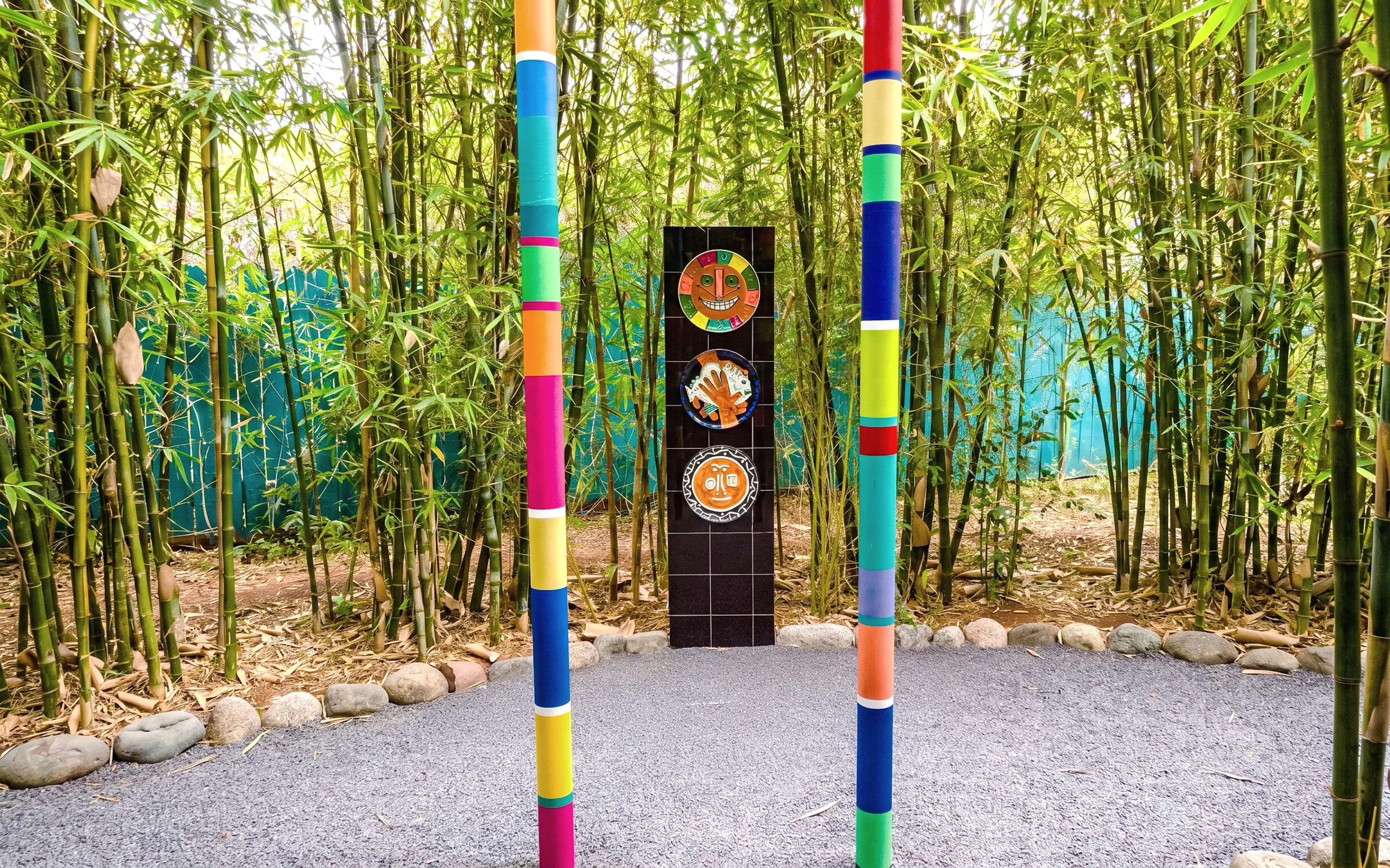 Colorful poles and art installation in bamboo grove at Anima Garden near Marrakech, Morocco.