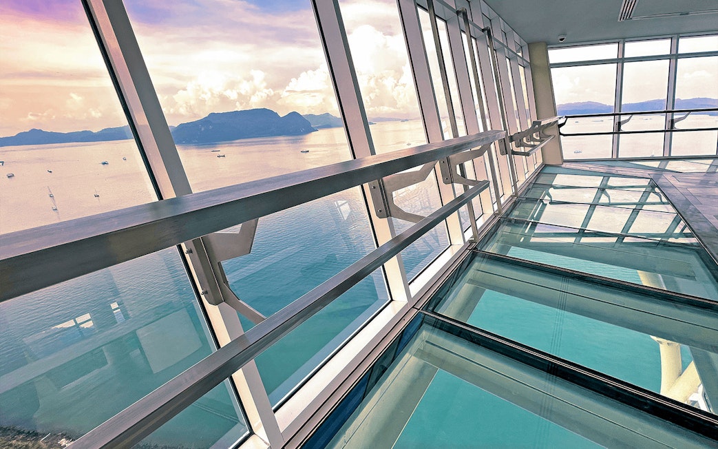 View from Maha Tower's glass floor overlooking the sea in Malaysia.