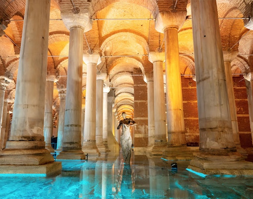 Basilica Cistern's illuminated columns and arches in Istanbul, showcasing ancient Byzantine architecture.