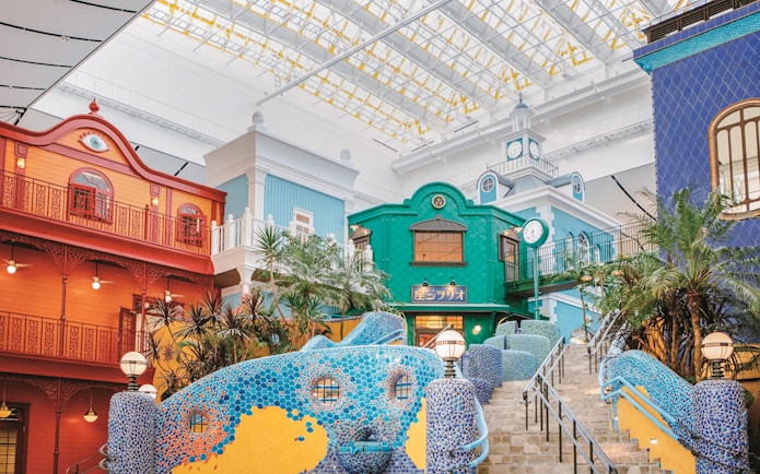 Colorful buildings and mosaic stairs at Ghibli Park, Japan.
