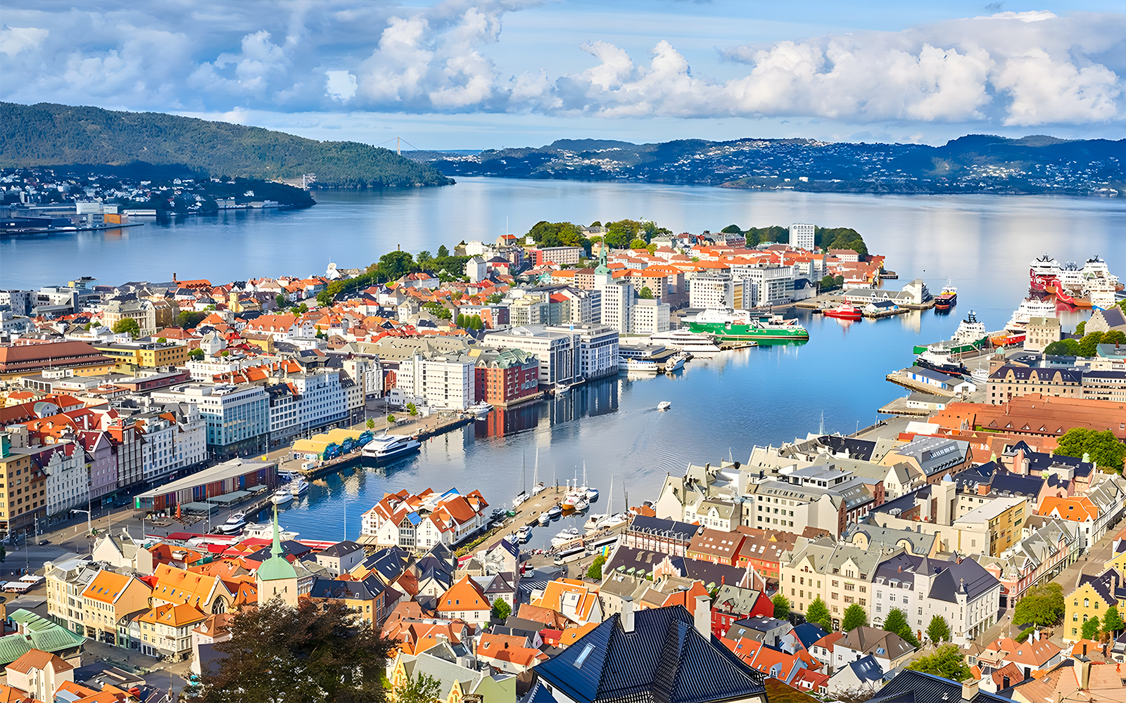 Bergen harbor view, starting point of the bus tour, with colorful buildings and fjord.