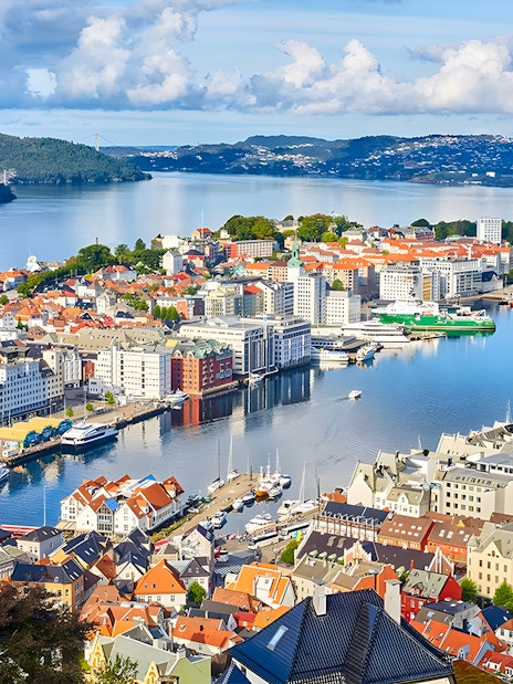 Bergen harbor view, starting point of the bus tour, with colorful buildings and fjord.