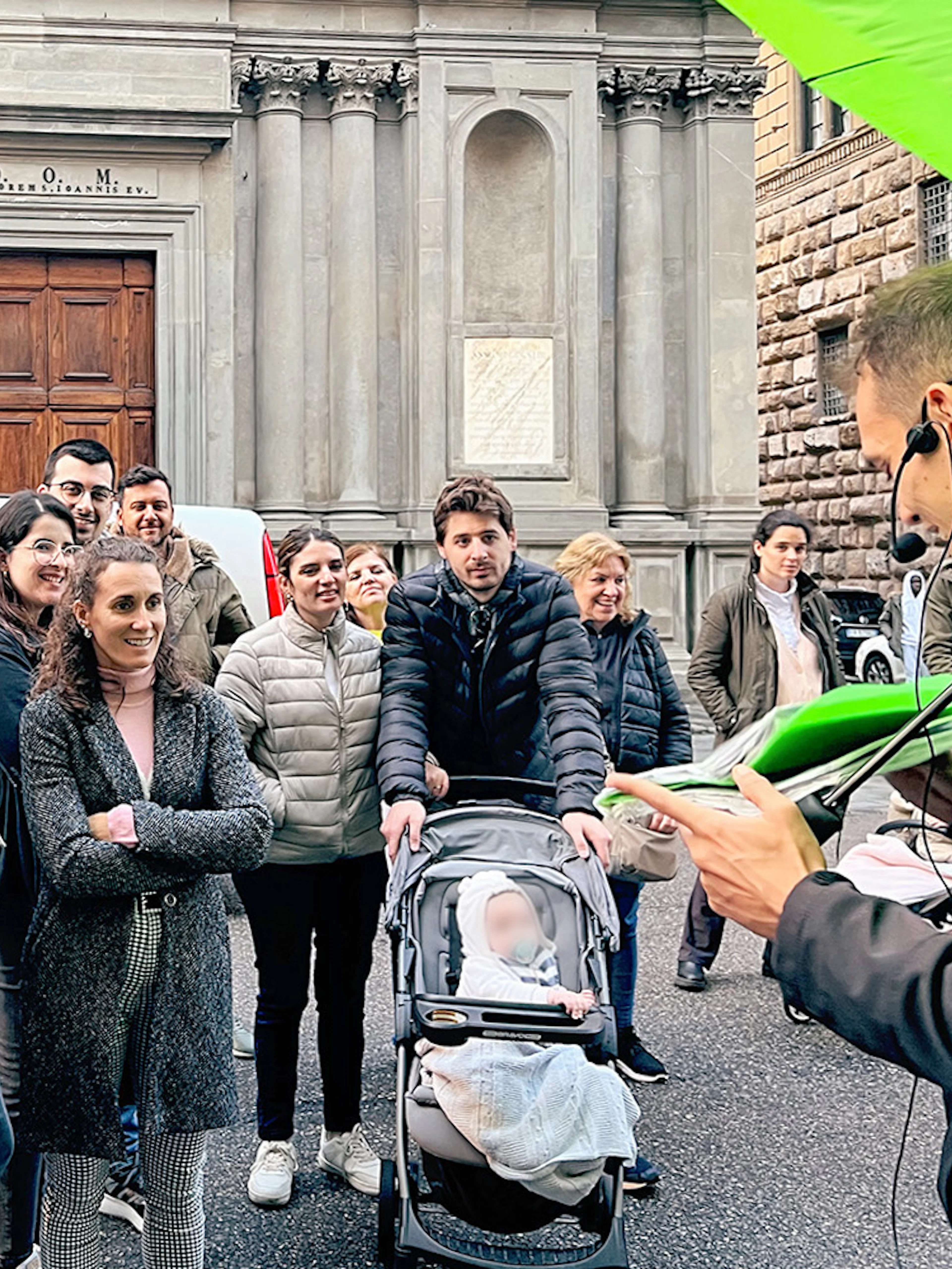 Tour group listening to a guide in Florence, Italy, during an essential walking tour.