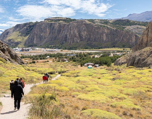 People hiking on Mirador de los Cóndores trail towards El Chaltén, Santa Cruz, Argentina.