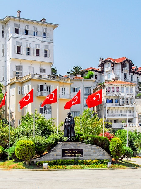 Streets of Princess Island with Turkish flags and historic buildings.