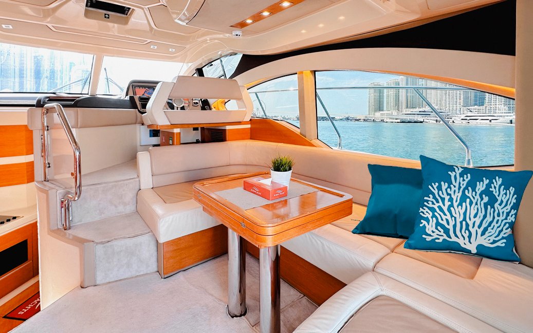 Luxurious yacht interior with seating area and sea view, Dubai.