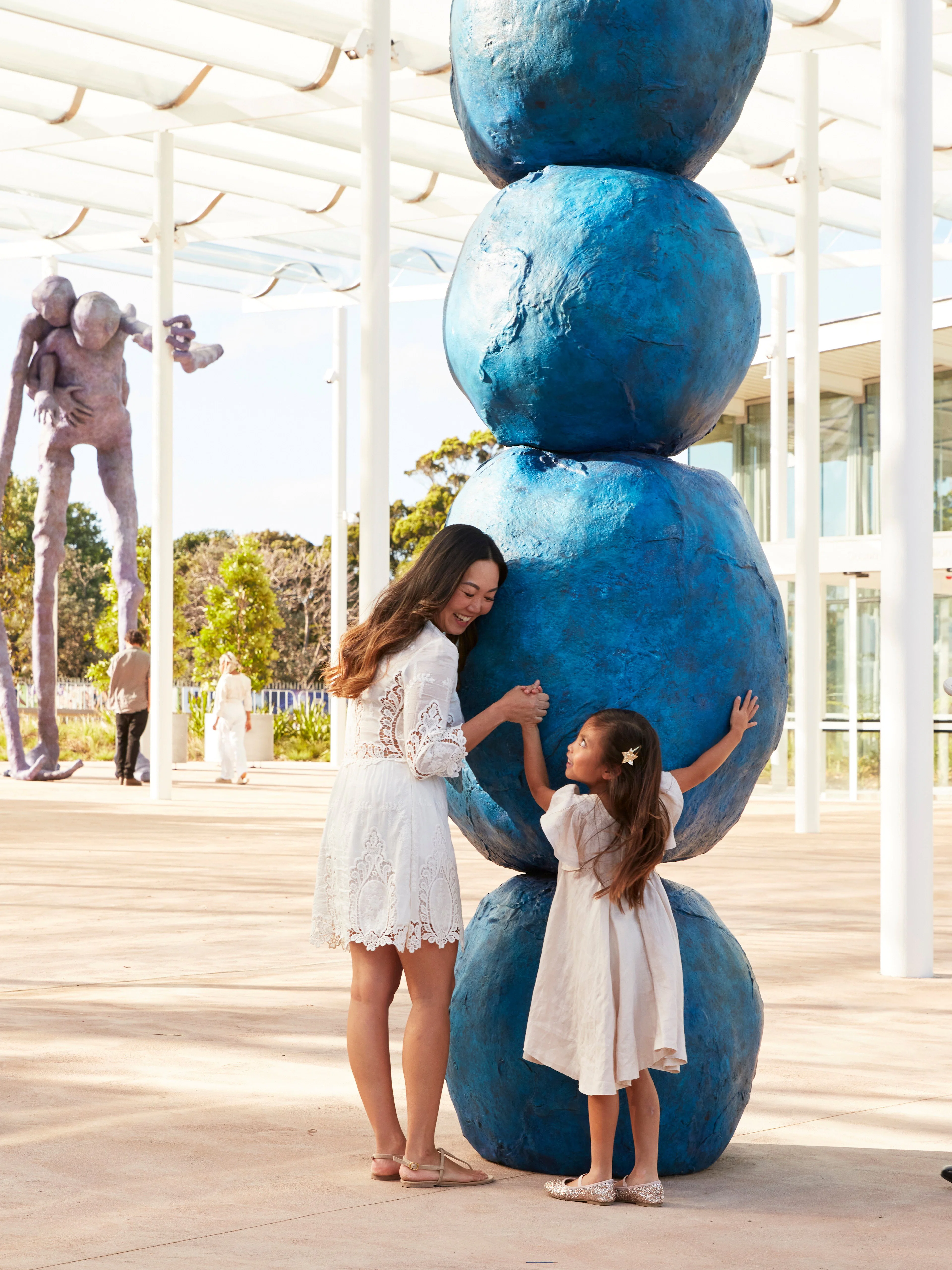Family interacting with Annie Morris's Stack sculpture at Art Gallery of New South Wales, Sydney.
