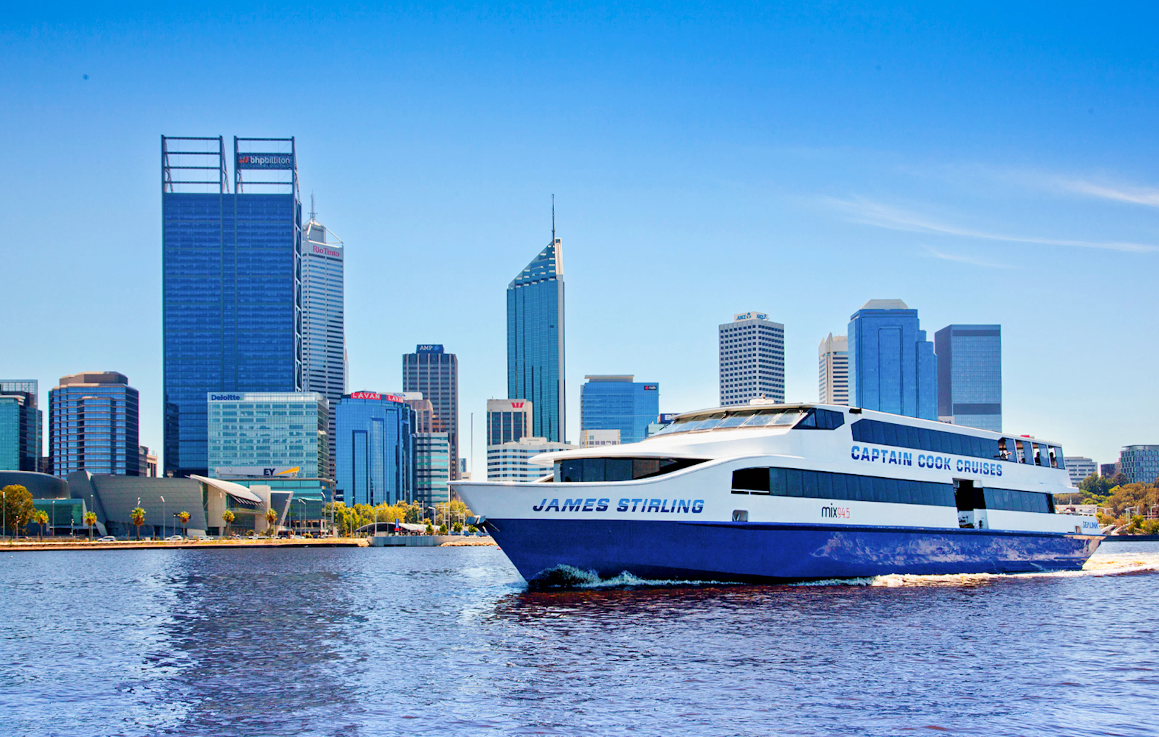 Cruise boat on Swan River with Perth skyline in the background.