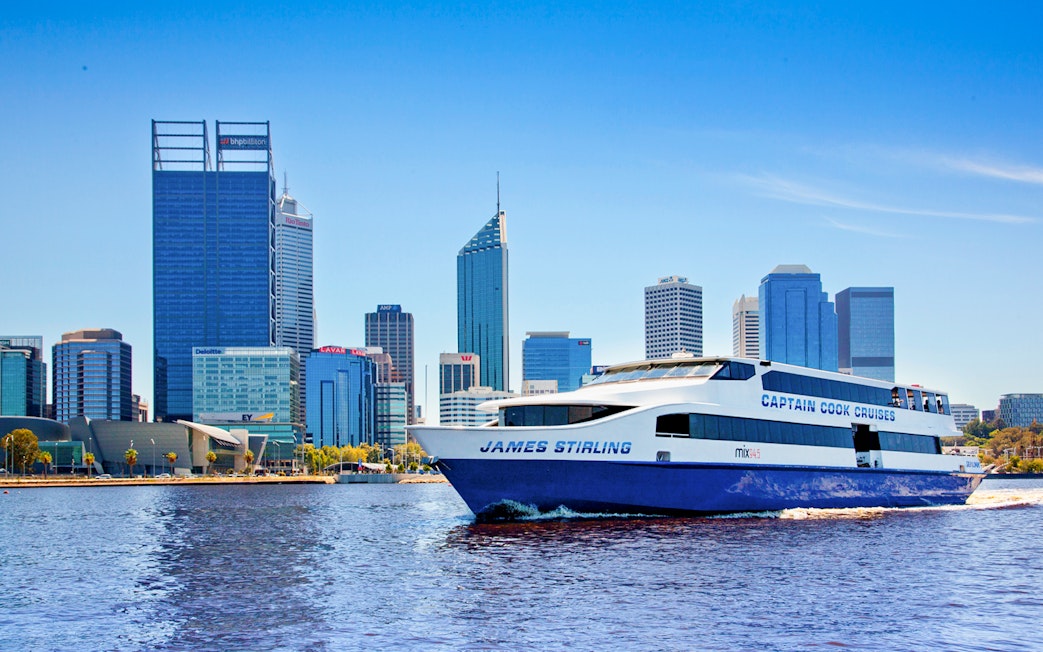 Cruise boat on Swan River with Perth skyline in the background.