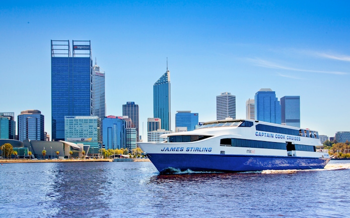 Cruise boat on Swan River with Perth skyline in the background.