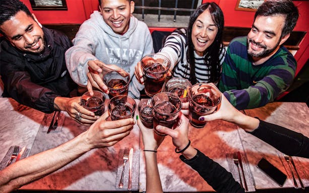 Group toasting drinks during La Barceloneta food tour.