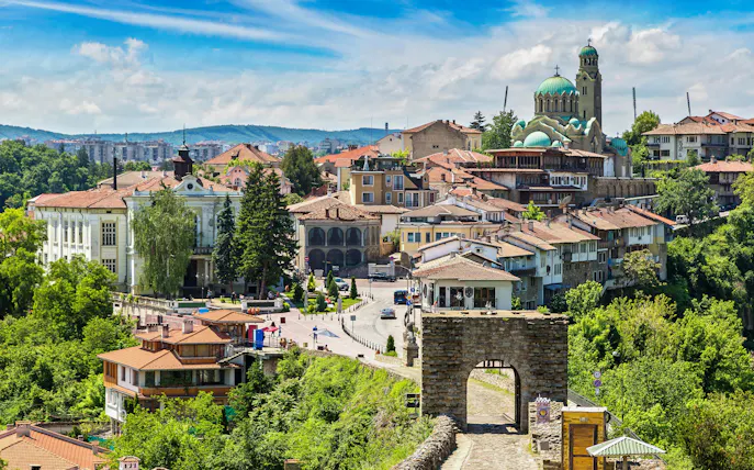 Tsarevets Fortress entrance with Veliko Tarnovo cityscape in the background, Bulgaria.