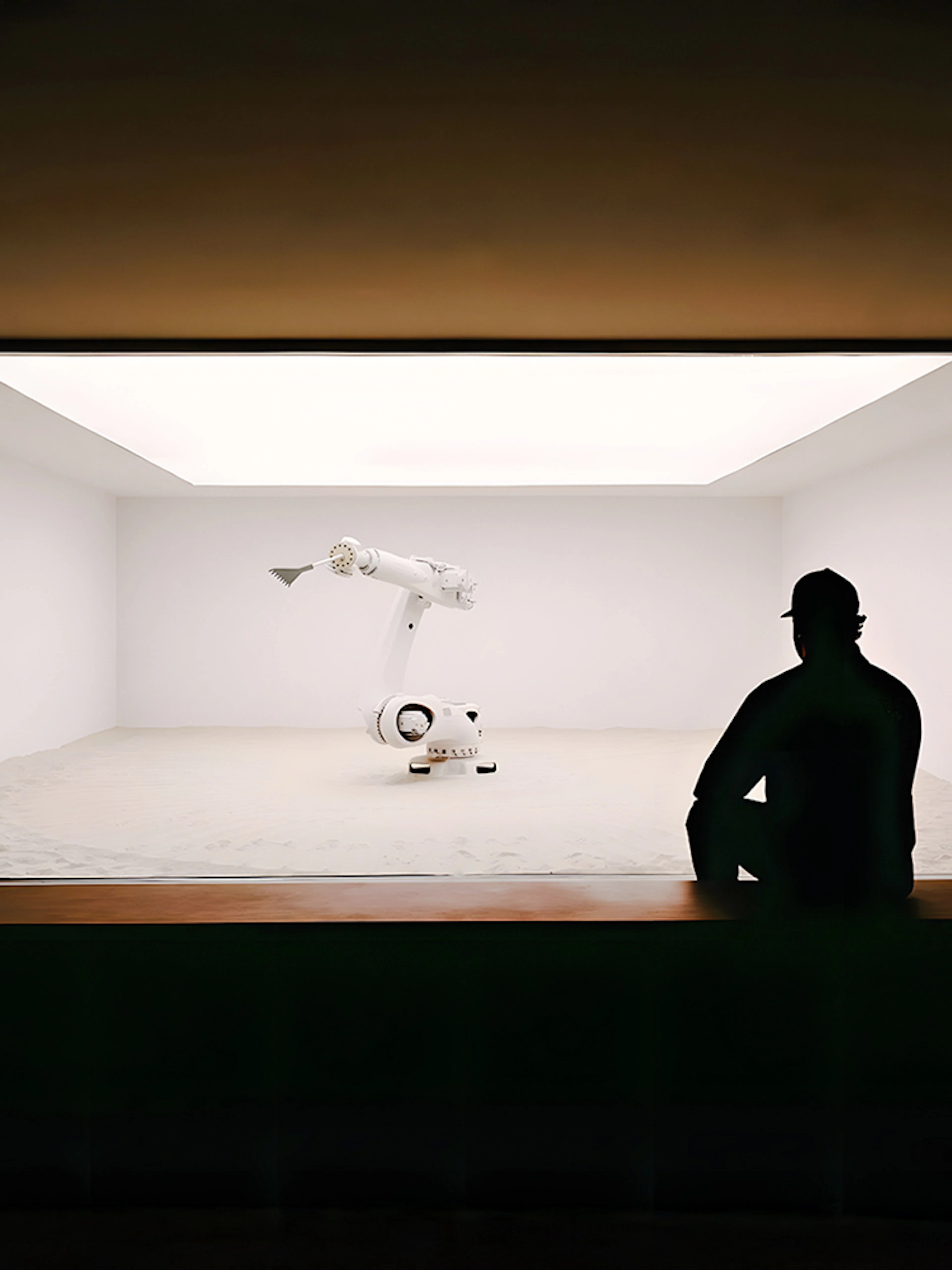 Robotic arm in a minimalist exhibit at Mercer Labs: Museum of Art & Technology.