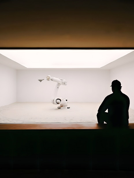 Robotic arm in a minimalist exhibit at Mercer Labs: Museum of Art & Technology.