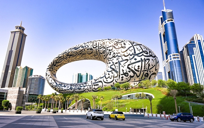 Museum of the Future in Dubai with surrounding skyscrapers, part of Big Bus tour.