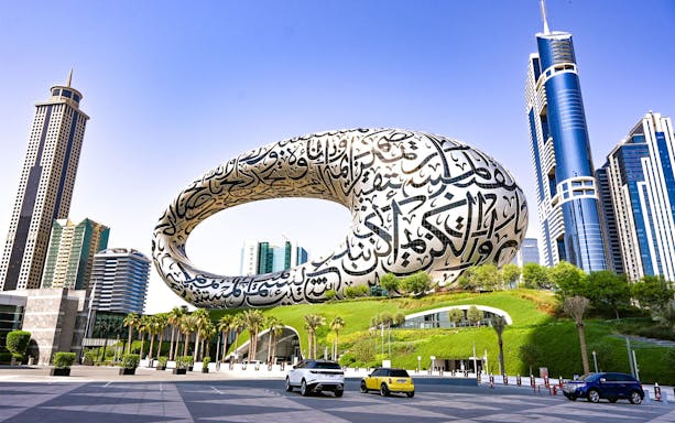 Museum of the Future in Dubai with surrounding skyscrapers, part of Big Bus tour.