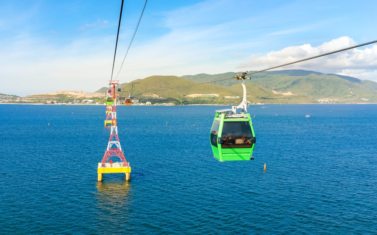Vinpearl Cable Car over ocean with mountains in Nha Trang, Vietnam.