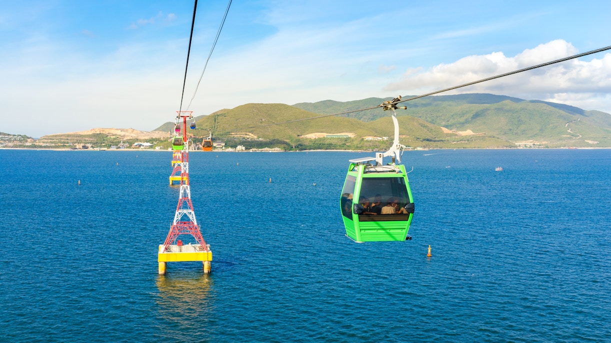 Vinpearl Cable Car over ocean with mountains in Nha Trang, Vietnam.