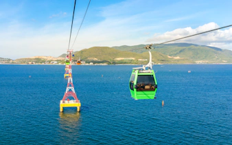 Vinpearl Cable Car over ocean with mountains in Nha Trang, Vietnam.